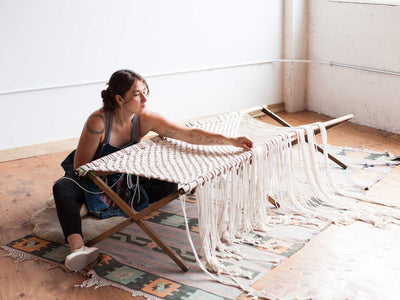 Interested in learning macrame? Learn with Emily Katz featured here making a macrame cot.