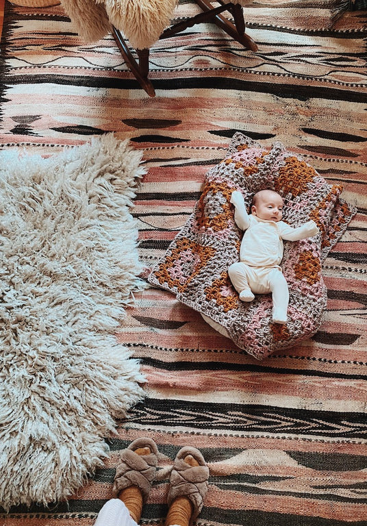 Emily Katz's new baby girl with our crocheted baby blanket using bamboo string! 