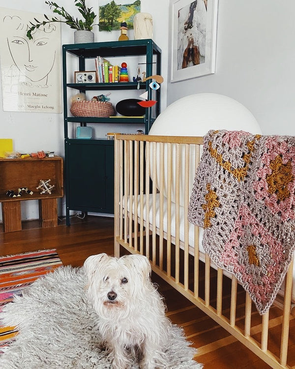 Emily's dog Donut and the Granny Square Blanket in Baby Palomino's nursery