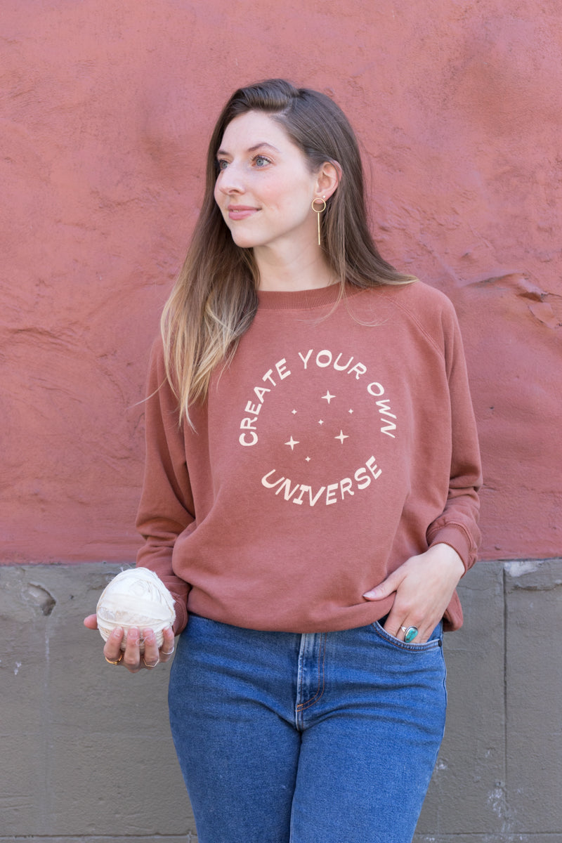 Nadya wearing the Create Your Own Universe Sweatshirt in Small
