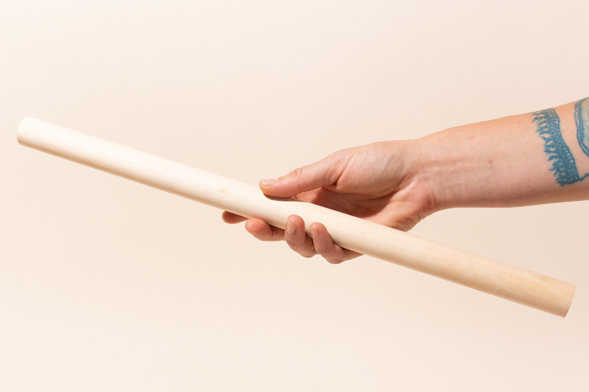 Hand Holding 24" Wooden Dowel