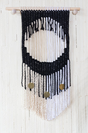 Photo B: Lunar intentions using natural, bright white, and black fiber