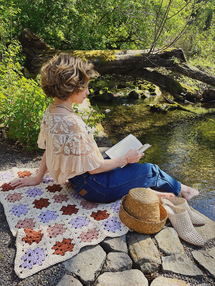 Perfect for an afternoon reading the Crocheted Granny Square Blanket featured at Crystal Springs Rhododendron Garden 